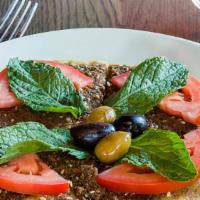 Zaatar Pizza · thyme, sesame seeds, sumac, mint, olives, tomato, extra virgin olive oil (VG)