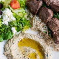 Lamb Kabob · parsley, onion, sumac, basmati rice. Served with pita bread + your choice of one dip and one...