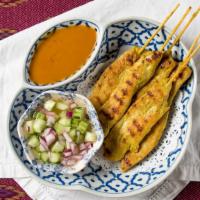2433. Grilled Chicken Satay · Skewered strips of chicken marinated in a special blend of Thai spices and coconut milk. Gri...