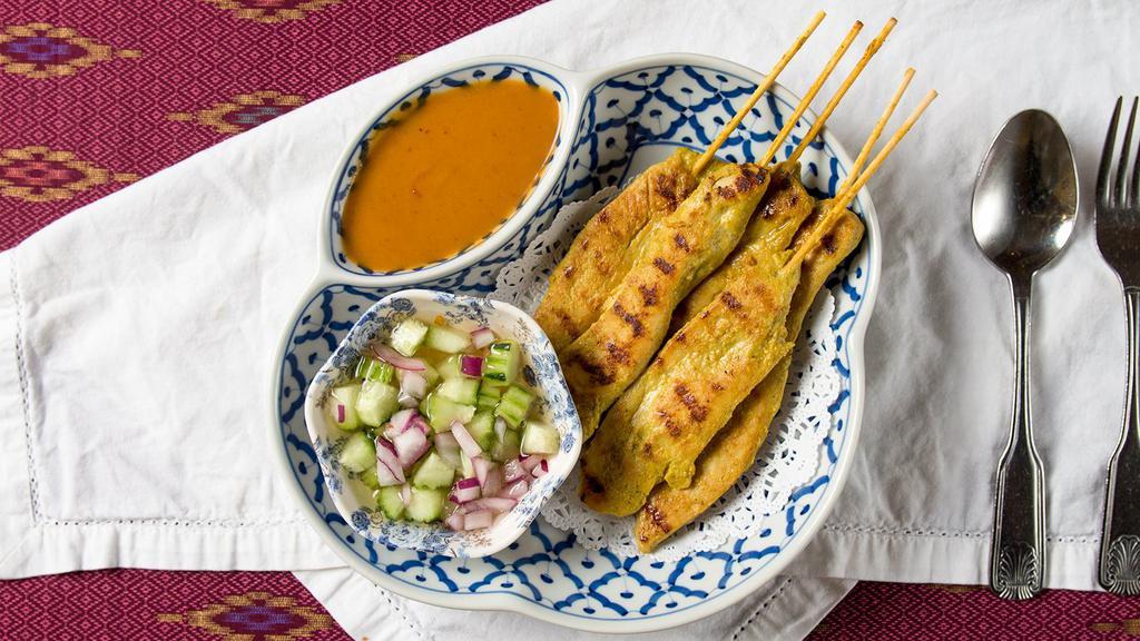2433. Grilled Chicken Satay · Skewered strips of chicken marinated in a special blend of Thai spices and coconut milk. Grilled and served with cucumber dip and tasty peanut sauce.