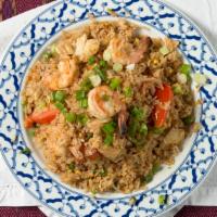 2487. Thai Fried Rice · Rice sauteed with egg, onion, green onion, tomatoes, green peas, and carrot.