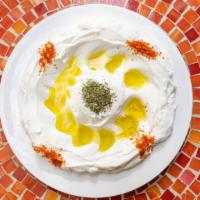 Lebni · Vegetarian. Strained yogurt drizzled with olive oil, dry mint and Aleppo pepper.