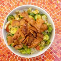 Fattoush Salad · Vegetarian. Romaine lettuce, tomatoes, cucumber, fresh mint, onion, sumac, olive oil, lemon ...