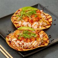 Mokuzai “Taco” · 2 pieces. Crab, spicy tuna, avocado, serrano, cilantro, eel sauce, sesame on tostada.