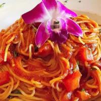 Cappellini Al Pomodoro · Angel hair pasta, garlic, fresh basil tomato sauce.