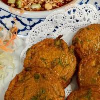 Fish Cake (5 Pieces) · Fish cake patties seasoned with curry paste and green bean, deep-fried and served with cucum...