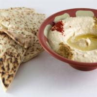 Hummus- 8Oz · Chickpeas, olive oil, and tahini, whipped with garlic and lemon juice, served with pita. - V...