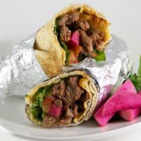 Beef Shawarma Sandwich  · Sizzling beef shawarma, lettuce, tomatoes, and pickles, drizzled with tahini wrapped in warm...