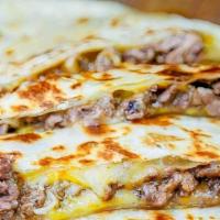 Carne Asada Quesadilla · Flour tortilla, carne asada, cheese, salsa on the side.