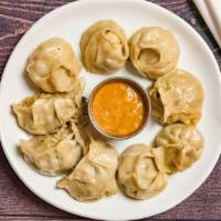 Vegetable Momo · Staple dish of Nepal. Flour pastry filled with spiced vegetables pinched into bite size parc...