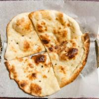 Plain Naan (Butter Naan) · Traditionally baked butter naan made here fresh In tandoor oven.