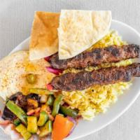 Kafta Kabab · Comes with rice and, choice of two appetizers, pita bread and garlic sauce.