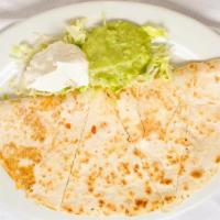 Quesadilla · Choice of shredded beef or chicken served with sour cream and guacamole.