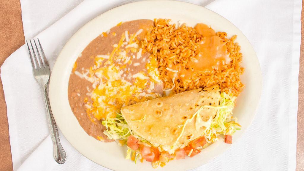 Any One Item · Served with rice refried beans and lettuce choice of shredded beef or shredded chicken.