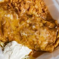 Chimichanga · Large flour tortilla filled with refried beans choice of shredded chicken, smothered in home...