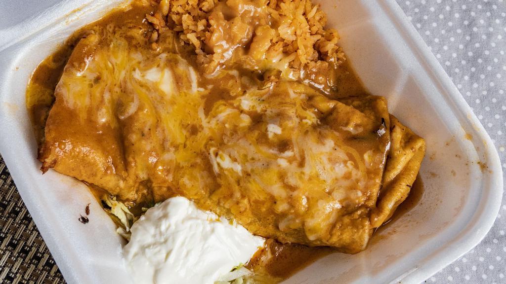 Chimichanga · Large flour tortilla filled with refried beans choice of shredded chicken, smothered in homemade enchilada sauce or shredded beef, smothered in homemade ranchera sauce, both topped with cheese.
