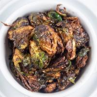 Fried Brussels Sprouts · Tossed in a honey chili balsamic sauce.
