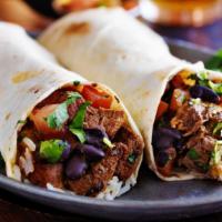 Steak Burrito · Fresh wrapped burrito stuffed with steak, rice, beans and pico de gallo.