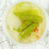 Wonton Soup · Shrimp, chicken, napa cabbage, snap peas, carrots and freshly made chicken dumplings in fres...