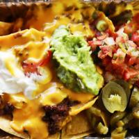  Jimmy Nachos · Zesty ground beef topped with nacho cheese sauce, sour cream, salsa, and jalapenos.