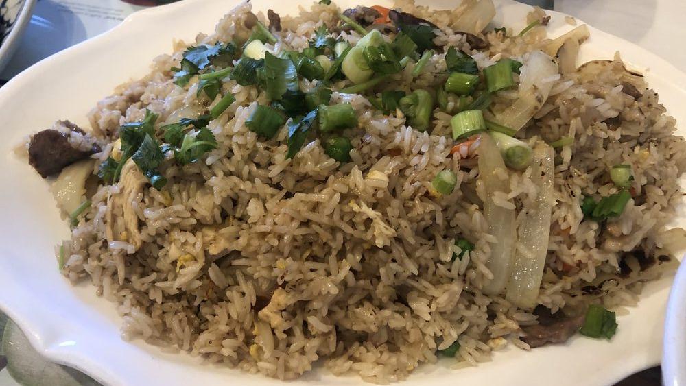 Spicy Fried Rice · Basil, onions, carrots, green peas, bell pepper.