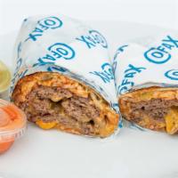 Smash Burrito · Harris ranch beef, yellow Cheddar, beans, rice, chopped onions, chopped pickles, fry sauce.