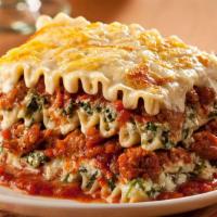 Lasagna · Lasagna topped with classic cheese, tomato sauce, and ground beef.