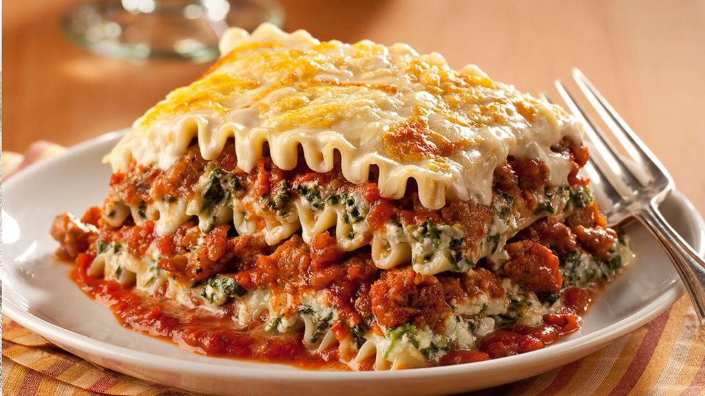 Lasagna · Lasagna topped with classic cheese, tomato sauce, and ground beef.