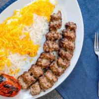 Beef Koobideh · Two skewers of freshly ground beef seasoned with onion and spices and broiled over an open f...