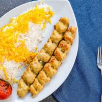 Chicken Koobideh · Two skewers of freshly ground chicken seasoned with onions and spices and broiled over an op...