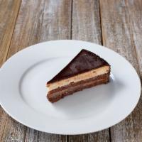 Chocolate Temptation · Chocolate cake filled with chocolate cream, hazelnut cream and hazelnut crunch, finished wit...