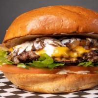 Cheeseburger · Toasted burger bun with a fresh beef patty, American cheese, lettuce, tomato, raw onion and ...