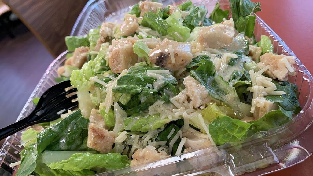 Caesar Salad · Romaine lettuce, Parmesan, croutons, and Caesar dressing.