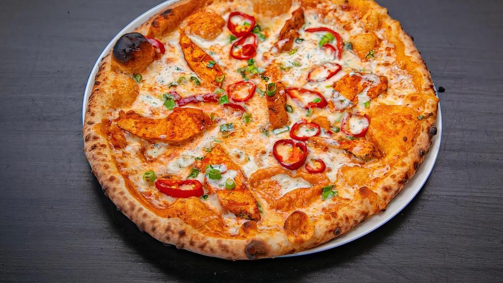 Buffalo Chicken Pizza · Housemade ranch base, chicken breast tossed in Housemade Buffalo sauce, red onion, fresno chilis.
