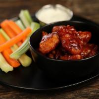 Boneless Wings - Classic Bbq (8) · 8 boneless wings tossed in BBQ (mild heat), served with carrots & celery and a dipping sauce...