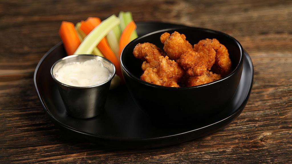 Cajun · 8 boneless wings tossed in Cajun dry rub (mild heat), served with carrots & celery and a dipping sauce of your choice.