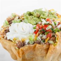 Tostada Bowl · Rice, beans, your choice of meat, lettuce, cheese, sour cream, guacamole, and fresh salsa.