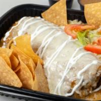 Wet Burrito · Any choice of meat with beans, rice, cilantro, onions, red or green salsa. Topped with chees...