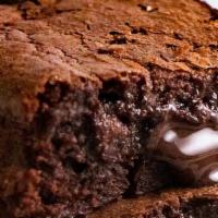 Mini Chocolate Brownie  · A rich dark  chocolate fudge brownie with chocolate signature sauce drizzled on top garnishe...