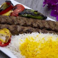 Beef Koobideh · Two skewers of ground beef, served with basmati rice grilled tomato, onions, and greens pepp...