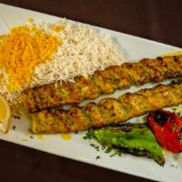 Chicken Koobideh · Two skewers of ground chicken served with basmati rice, grilled tomato, onions, and green pe...