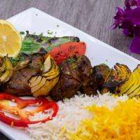 Beef Shish Kabob · Marinated beef fillet mignon served with basmati rice and grilled tomato, onions, and green ...