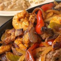 Fajitas Especiales · Shrimp, steak and chicken fajitas. Served with rice, beans, salad and flour or corn tortillas