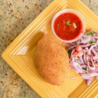 Papa Rellena · Stuffed potato with seasoned beef, onions, tomatoes, a touch of raisins, and olives. Served ...