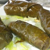 Dolma Appetizer · 5 grape leaves stuffed with rice, lemon juice, herbs and spices, cooked to perfection and se...