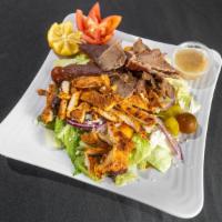 Paradiso Salad · Greek salad topped with gyro meat and charbroiled chicken breast. Served with homemade medit...