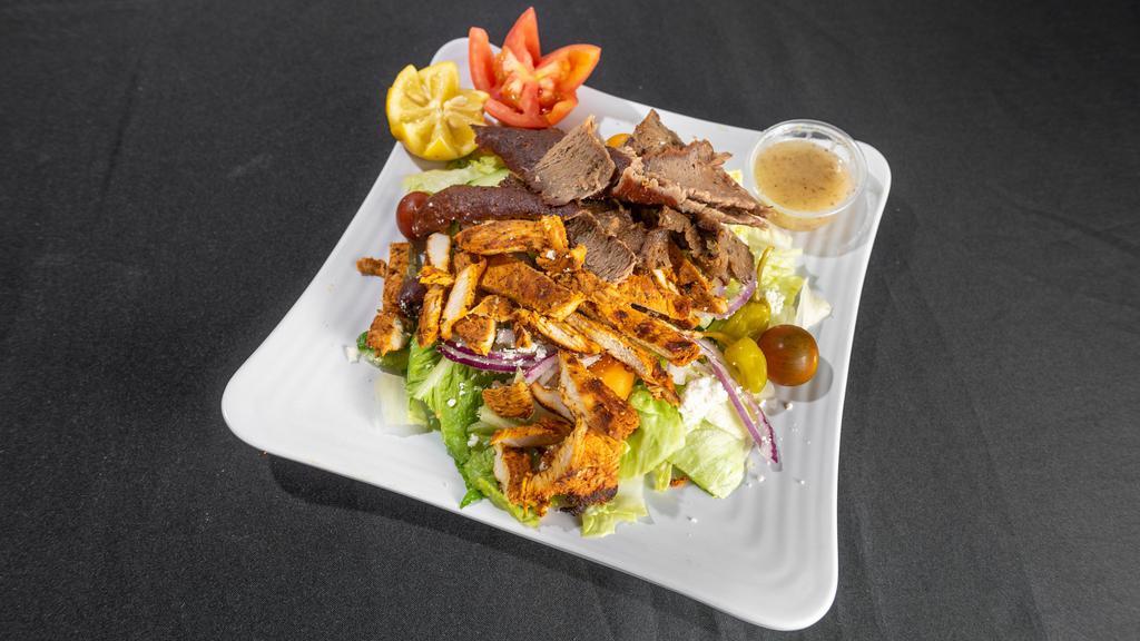 Paradiso Salad · Greek salad topped with gyro meat and charbroiled chicken breast. Served with homemade mediterranean dressing, pita bread and tzatziki sauce.