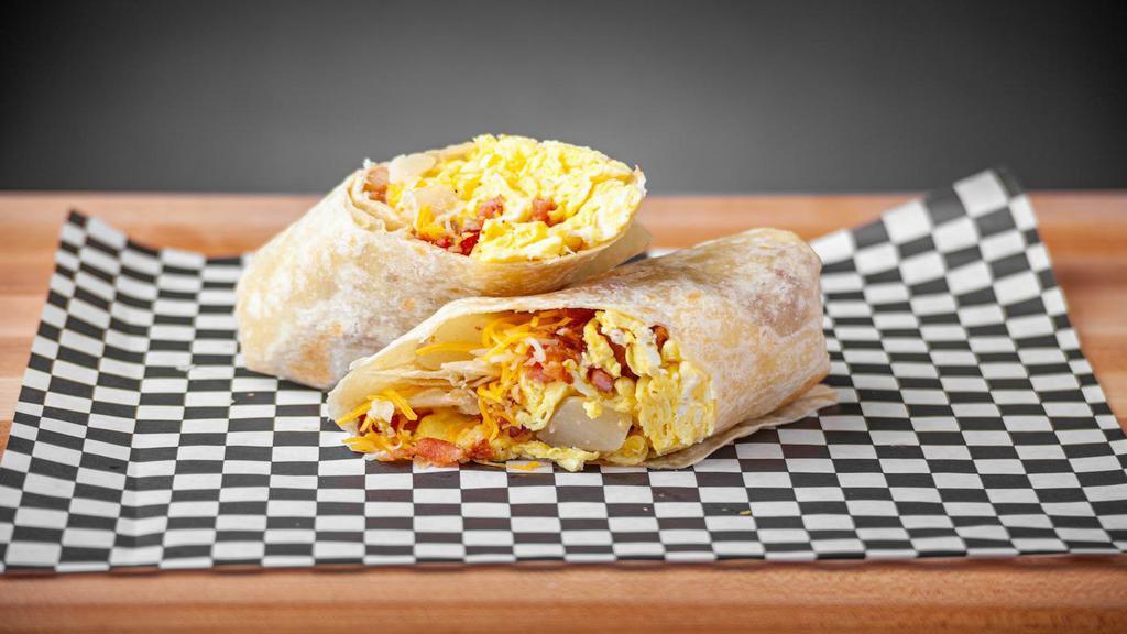 Bacon Breakfast Burrito · Flour tortilla with scrambled eggs, bacon, breakfast potatoes and cheddar cheese.