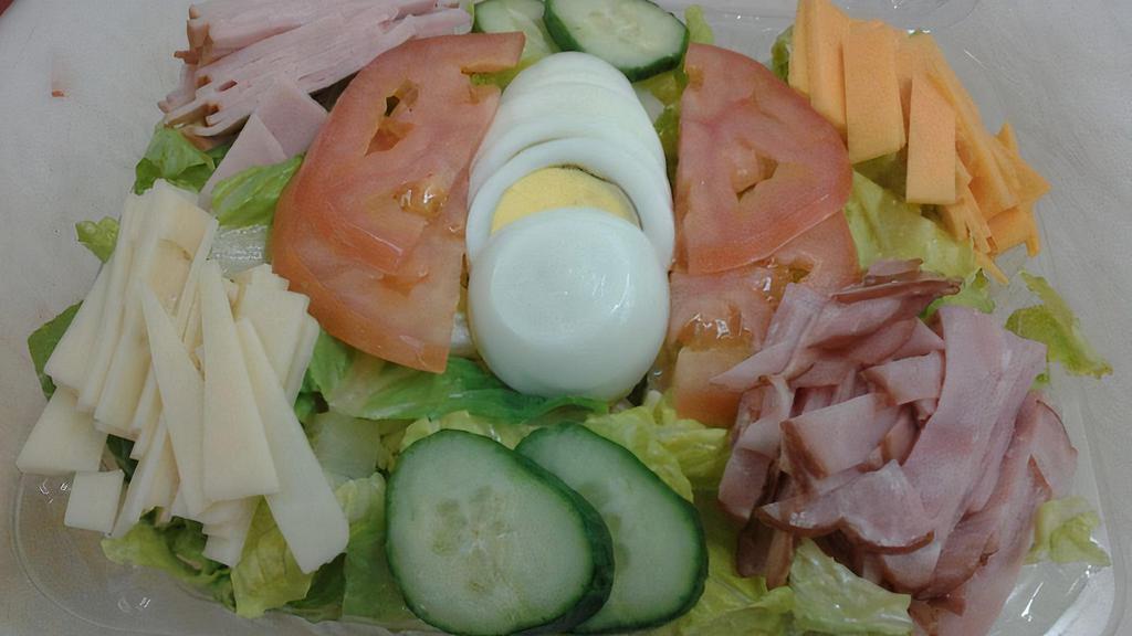 Chef Salad · Crisp romaine lettuce tomato cucumber ham smoked turkey cheddar cheese provolone and hard boiled egg.