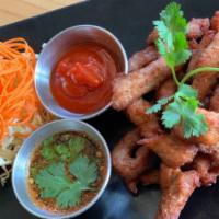 Thai Pork Jerky · Deep-fried marinated pork in authentic Thai-style served with sriracha and jaew dipping sauce.